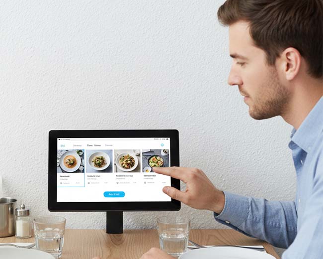 touch display solution applied in a restaurant setting, showing streamlined order processing